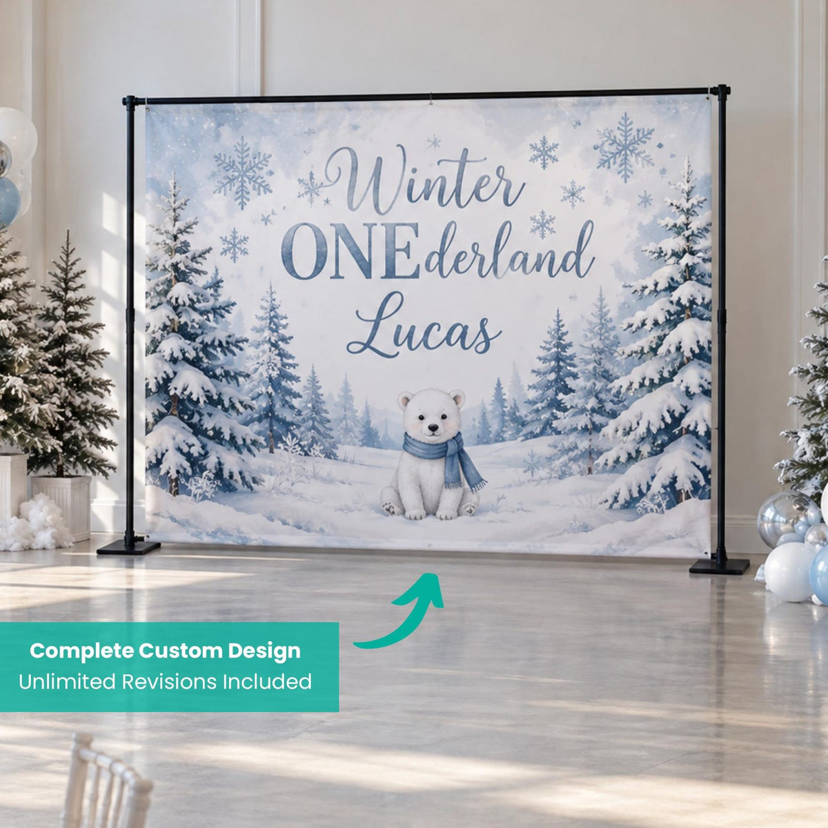 Blue Winter ONEderland first birthday backdrop with snowy trees and a small winter animal.