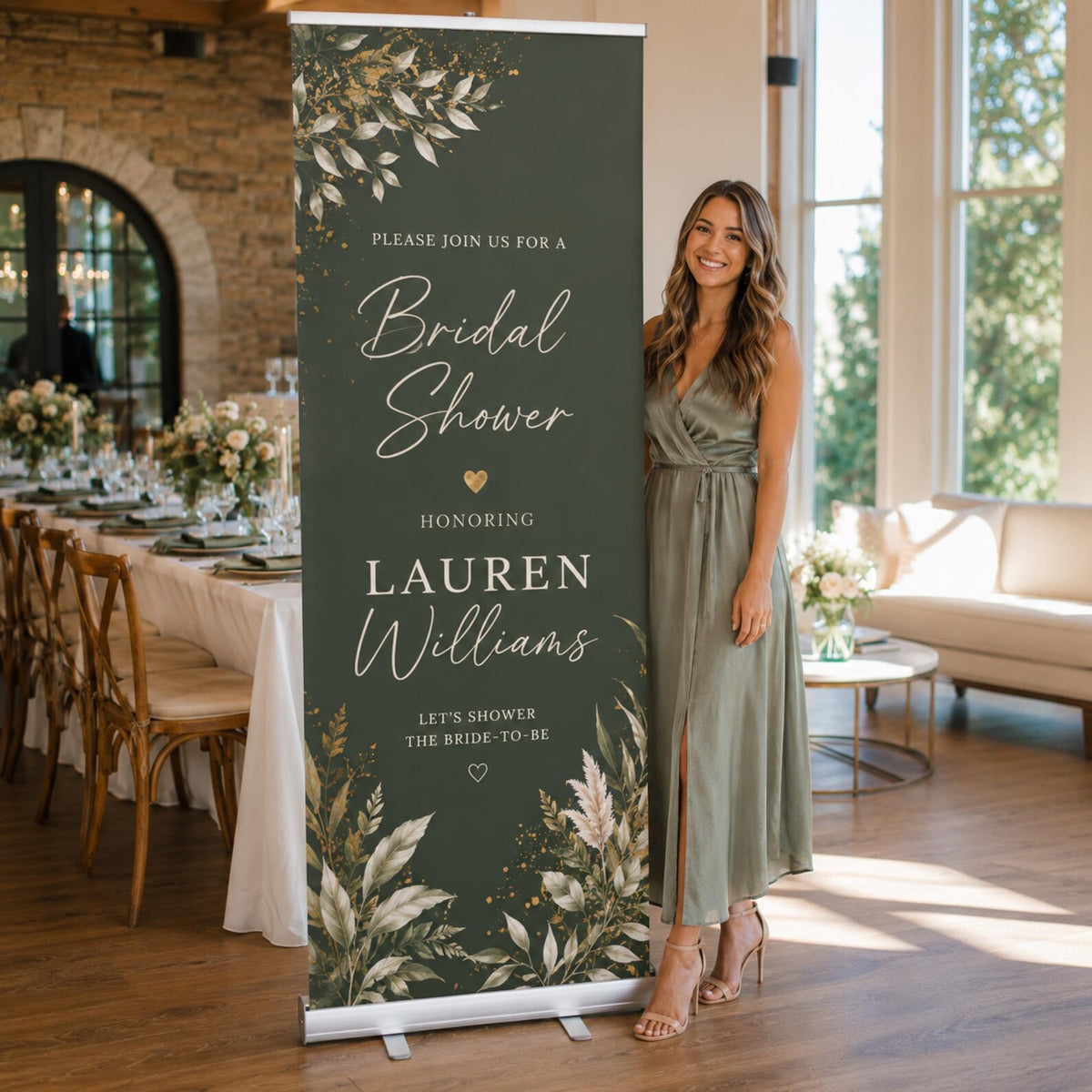 Dark green bridal shower banner with cream flowers, shown beside a person for scale.