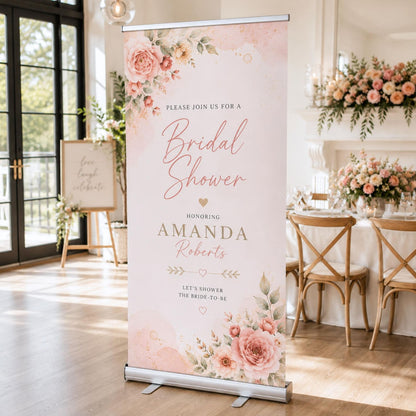 Amanda's blush pink bridal shower welcome banner displayed in a bright event room.